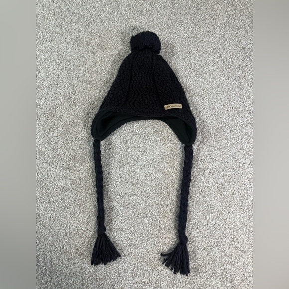 Like new Columbia Women’s Fleece-Lined Knit Trapper Hat Black with Pom & Braids - Picture 1 of 4